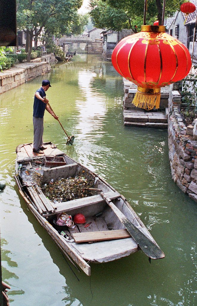cleaning the canal THE BEST DAY TRIP FROM SUZHOU 苏州 Luzhi 甪直 An Authentic Canal Town