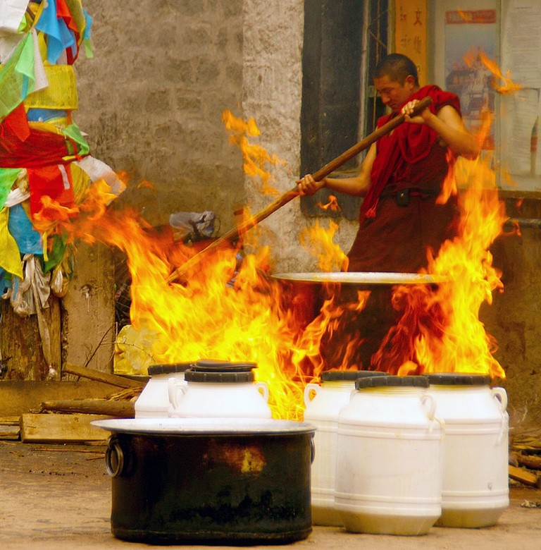 Boiling Yak butter tibetan monk